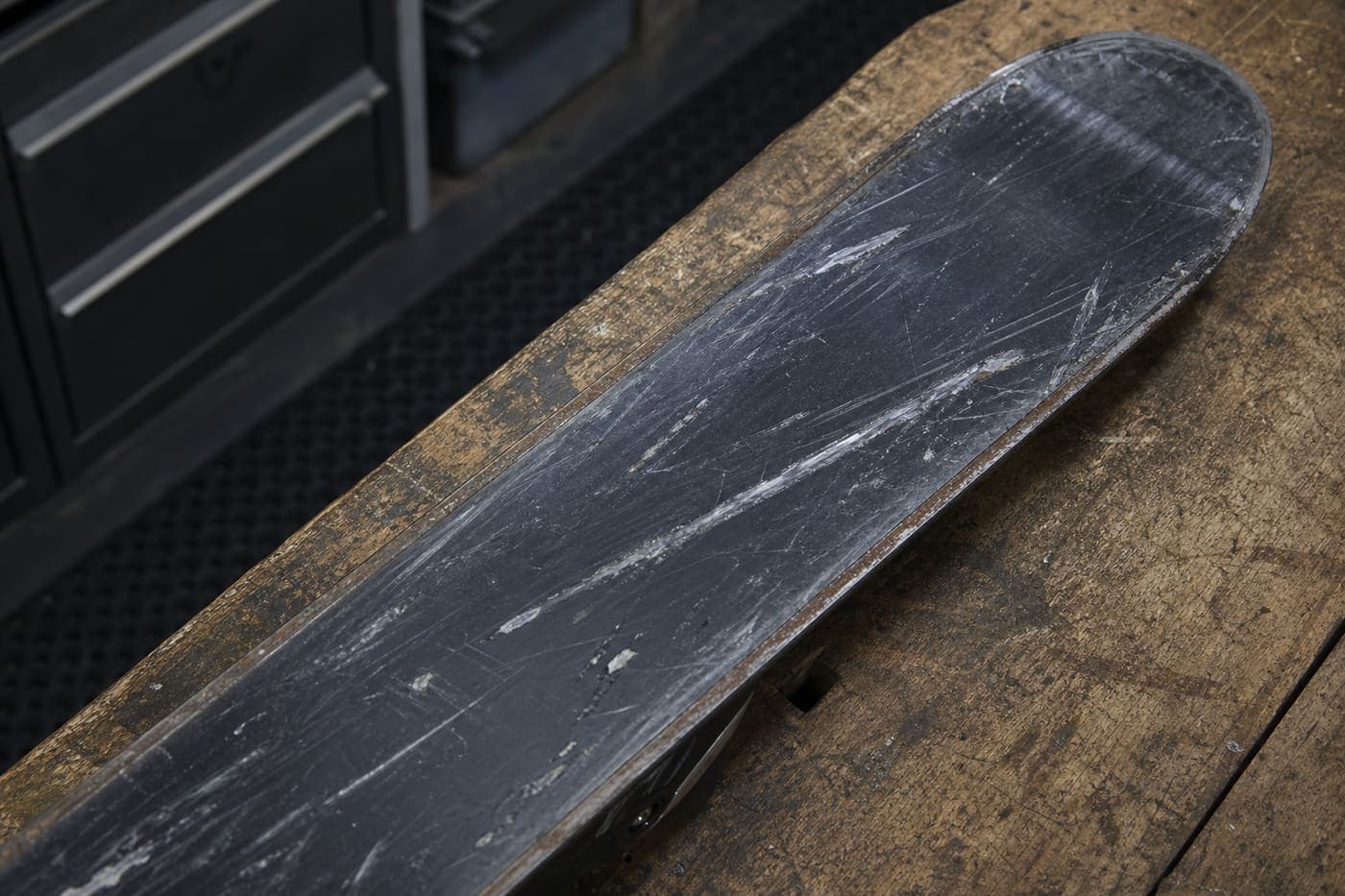 Scratched ski base before a FIRN tune